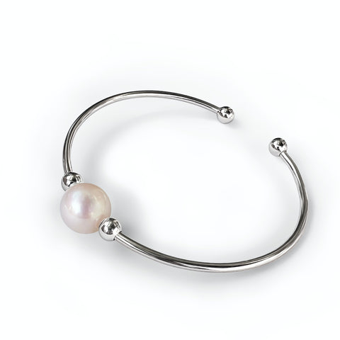 Bracelet  Jonc Astral  en argent 925 avec au centre une perle de culture d'eau douce   blanche diamètre 10 mm  encadrée de  deux petites perles en Argent 925 