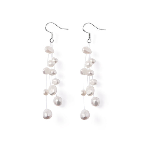 Boucles d’oreilles Constellation perles d’eau douce blanche sur fil de nylon et argent 925.